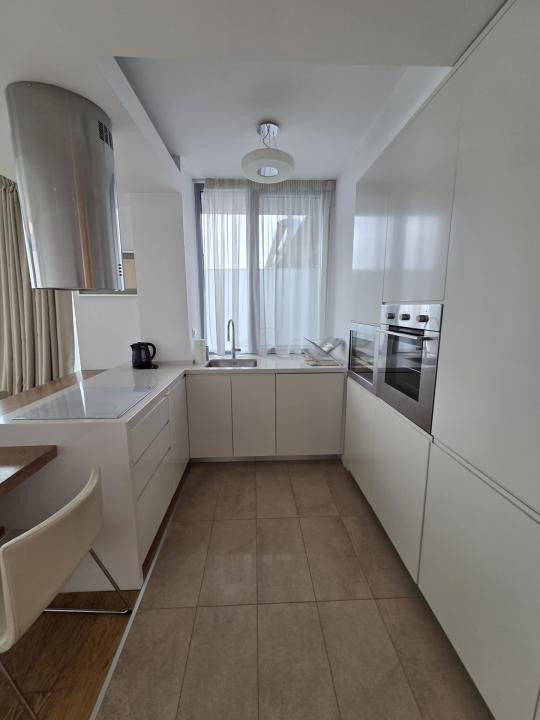 Elegant Top-Floor Apartment with Panoramic Terrace near Victoriei Avenue