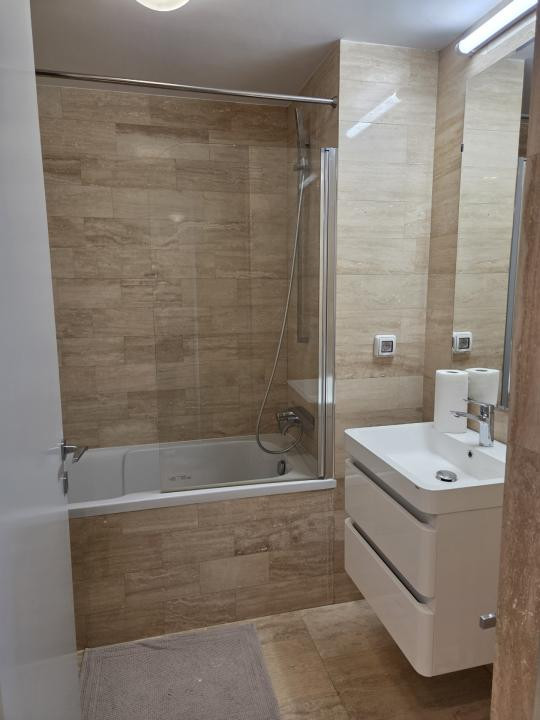 Elegant Top-Floor Apartment with Panoramic Terrace near Victoriei Avenue