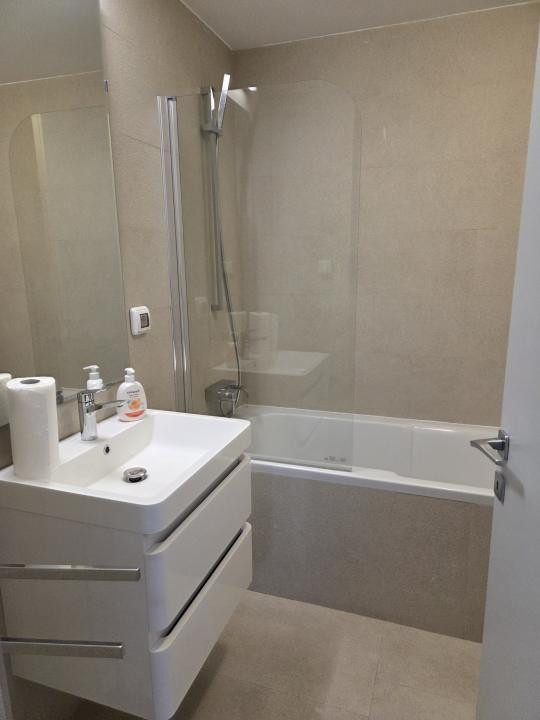 Elegant Top-Floor Apartment with Panoramic Terrace near Victoriei Avenue